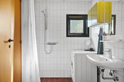 a bathroom with a sink and a shower at 157-Harboore-Vejlby-Klit-65 in Harboør