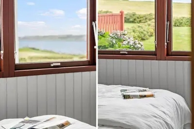 two pictures of a room with a window and a bed at G431-Lemvig-Gyvelvej-31 in Lemvig