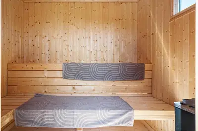 a sauna with a bed in a wooden room at G245-Lemvig-Porsevej-45 in Lemvig
