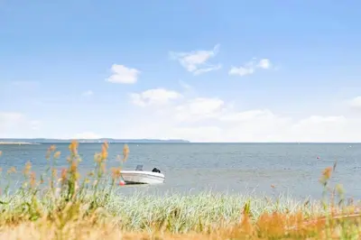 a boat sitting in the middle of the water at G245-Lemvig-Porsevej-45 in Lemvig