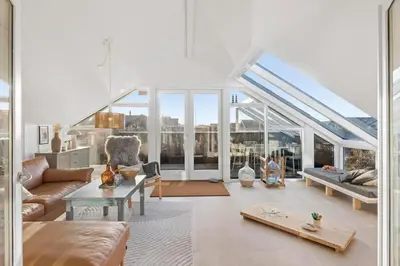 a living room with a couch and a table at 254-Harboore-Vejlby-Klit-251 in Harboør