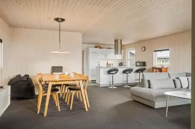 a living room with a table and a couch at 153-Harboore-Vejlby-Klit-77 in Harboør