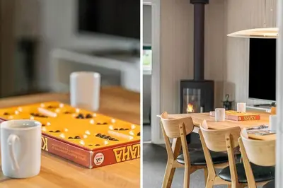 a room with a pizza box and a table with chairs at 153-Harboore-Vejlby-Klit-77 in Harboør