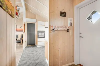 a hallway with a door leading to a kitchen at 234-Harboore-Neerlandiavej-21 in Harboør