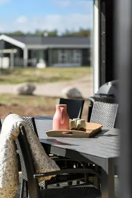 a pink vase sitting on top of a table at 362-Harboore-Gloryvej-6 in Harboør