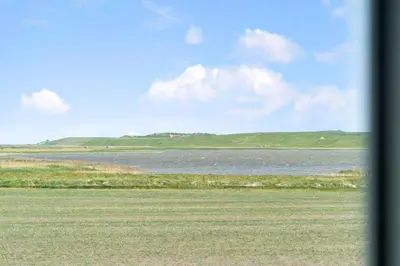 a view of a body of water with mountains in the background at 289-Harboore-Strandvejen-179 in Harboør