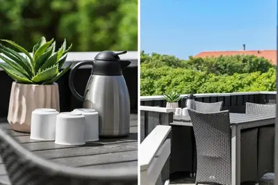 a table with a coffee maker and a potted plant at 111-Harboore-Vejlby-Klit-125 in Harboør