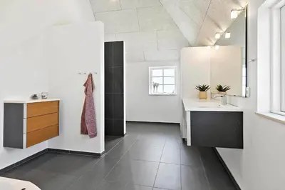 a bathroom with a sink and a mirror at 180-Harboore-Doblervej-89 in Harboør