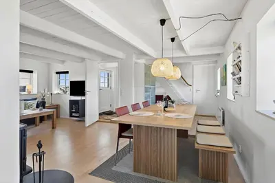 a dining room with a table and chairs at 180-Harboore-Doblervej-89 in Harboør