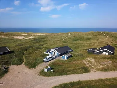 an aerial view of two houses and a van parked in a field at 205-Harboore-Doblervej-39 in Harboør