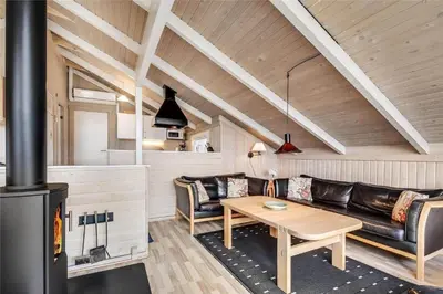 a living room with a couch and a table at 205-Harboore-Doblervej-39 in Harboør