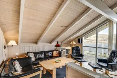a living room with a couch and a table at 205-Harboore-Doblervej-39 in Harboør
