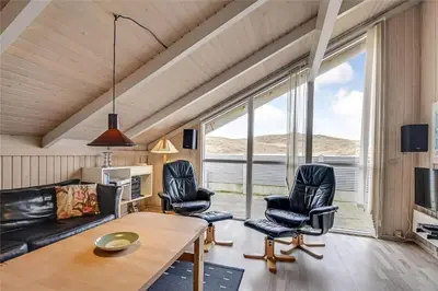 a living room with a couch and chairs and a table at 205-Harboore-Doblervej-39 in Harboør