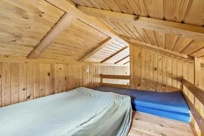 a sauna with a bed in a wooden room at 202-Harboore-Viktoriavej-12-a in Harboør