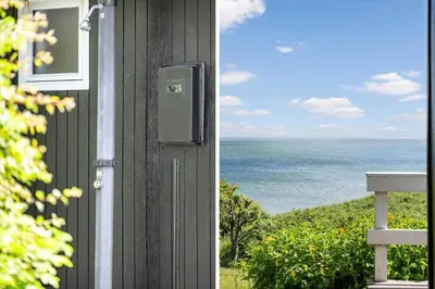 a door to a house with a view of the ocean at G398-Lemvig-Violvej-98 in Lemvig