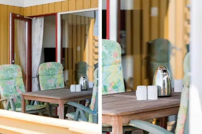 a wooden table with chairs and a tea kettle on it at 154-Harboore-Vejlby-Klit-103 in Harboør