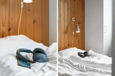 a pair of shoes sitting on top of a bed at 294-Harboore-Neerlandiavej-102 in Harboør
