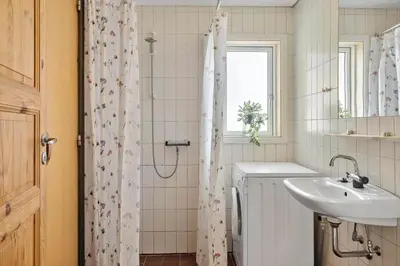 a bathroom with a sink and a shower at 294-Harboore-Neerlandiavej-102 in Harboør