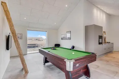 a living room with a pool table in a room at 350-Harboore-Alkajavej-13-A in Harboør