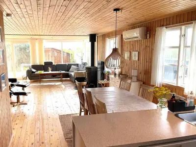a living room with a couch and a table at 251-Harboore-Neerlandiavej-230 in Harboør