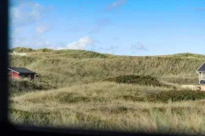 a view of a hill with houses on it at 332-Harboore-Hvilehjemsvej-20 in Harboør