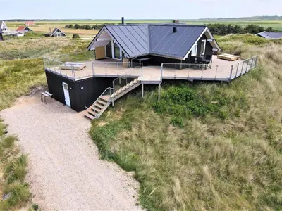 a house on a hill with a path leading to it at 257-Harboore-Dalevej-8 in Harboør