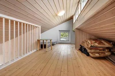 a large room with a bed and a table at G129-Lemvig-Gjelleroddevej-129 in Lemvig