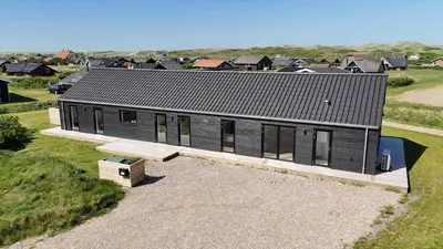 an overhead view of a black house with a bench at 272-Harboore-Neerlandiavej-196 in Harboør