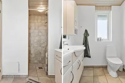 a white bathroom with a sink and a toilet at 114-Harboore-Strandvejen-164 in Harboør