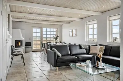 a living room with a couch and a table at 181-Harboore-Vejlby-Klit-78 in Harboør