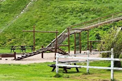 a park with benches and a wooden stair case at G126-Lemvig-Bynkevej-26 in Lemvig