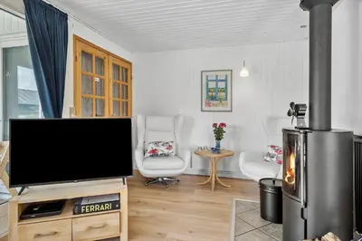 a living room with a large flat screen tv at 204-Harboore-Vejlby-Klit-33 in Harboør