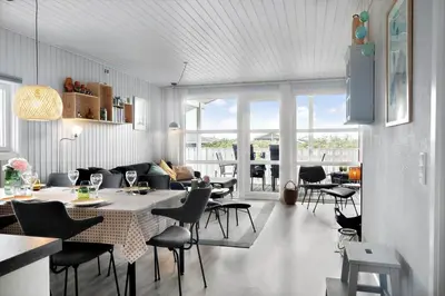 a living room with a table and chairs at 281-Harboore-Vejlby-Klit-27 in Harboør