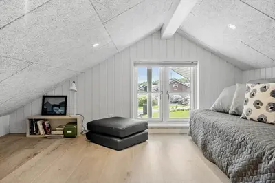 a bedroom with a bed and a large window at G509-Lemvig-Myntevej-9 in Lemvig