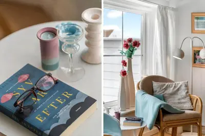 a book sitting on a table next to a table with a chair at 324-Harboore-Skalvej-4-b in Harboør