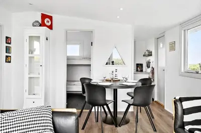 a kitchen and dining room with a table and chairs at G103-Lemvig-Klovervej-3 in Lemvig