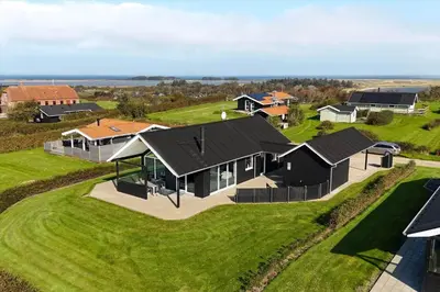 an overhead view of a house on a green field at G331-Lemvig-Myntevej-31 in Lemvig