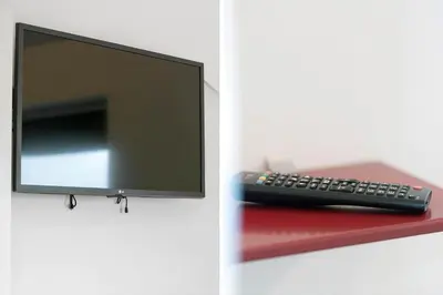 a remote control sitting on top of a red table at G331-Lemvig-Myntevej-31 in Lemvig