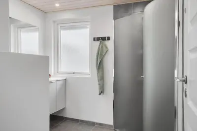 a bathroom with a shower stall and a window at G113-Lemvig-Nellikevej-13 in Lemvig