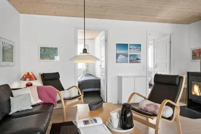a living room with a couch and chairs at 325-Harboore-Skalvej-4-c in Harboør
