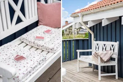 a white chair and a pillow on a porch at 267-Harboore-Vaermlandvej-10 in Harboør