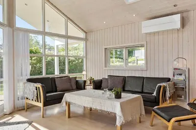 a living room with a couch and a table at G139-Lemvig-Porsevej-39 in Lemvig