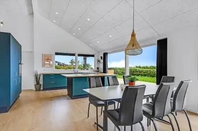 a kitchen and dining room with a table and chairs at G307-Lemvig-Bynkevej-7 in Lemvig