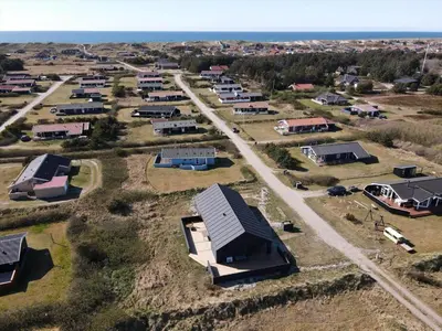an aerial view of a village with houses at 255-Harboore-Vejlby-Klit-37-A in Harboør