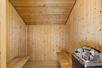 a wooden sauna with a trash can in it at 259-Harboore-Vejlby-Klit-129 in Harboør