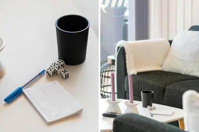 a living room with a chair and a table with a laptop at 212-Harboore-Neerlandiavej-62 in Harboør