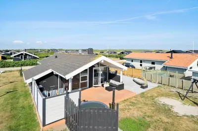 an overhead view of a house with a deck at 212-Harboore-Neerlandiavej-62 in Harboør