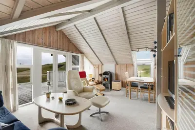 a living room with a couch and a table at 108-Harboore-Merchantvej-10-C in Harboør
