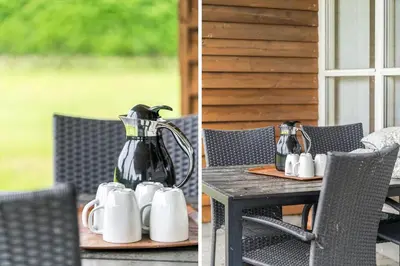 a table with a pitcher and mugs on it at G124-Lemvig-Porsevej-24 in Lemvig
