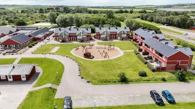 an aerial view of a home with a playground at G261-Lemvig-Vinkelhagevej-161 in Lemvig